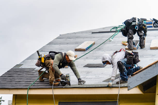 Professional Roofing technician working in West Newton, MA